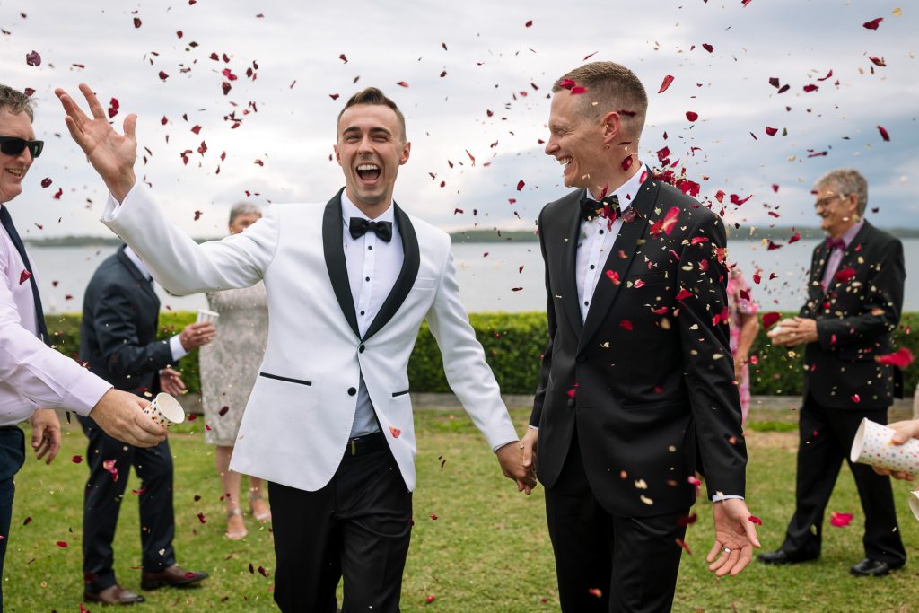 same sex marriage walking down the confetti with rose petals confetti