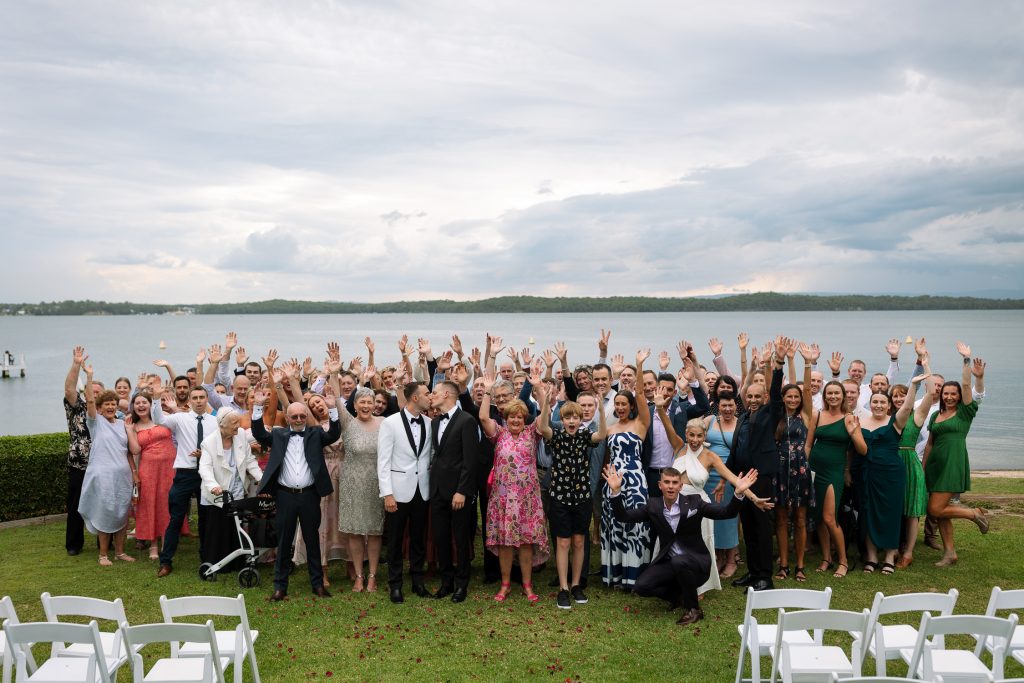same sex marriage at raffertys resort during the ceremony big group photo of all the guests