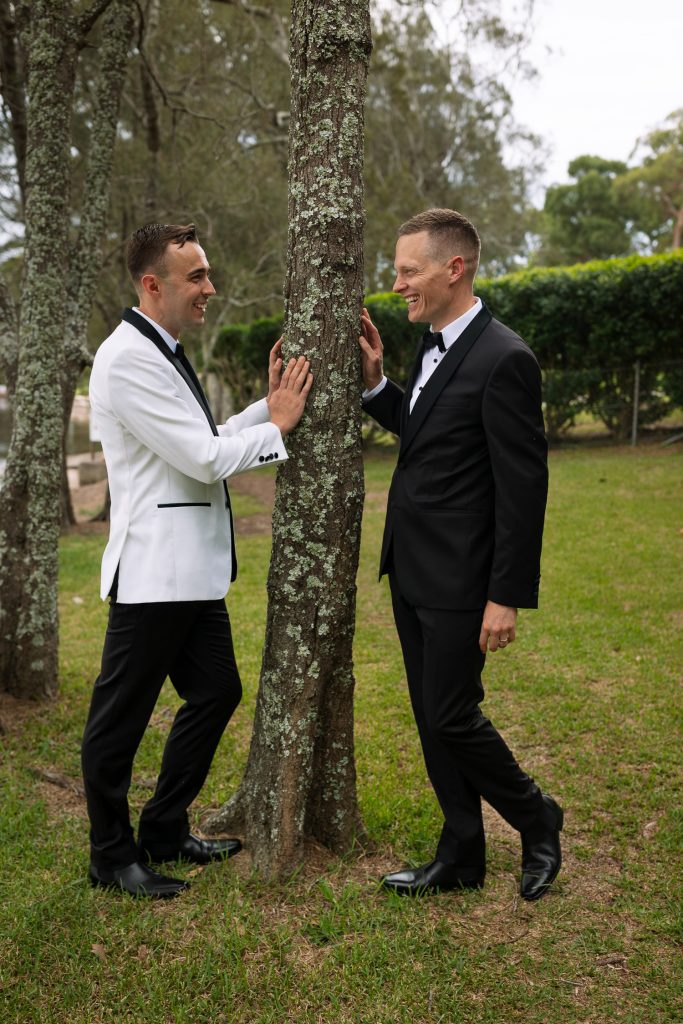 husband and husband at raffertys resort during the groom photo shoot