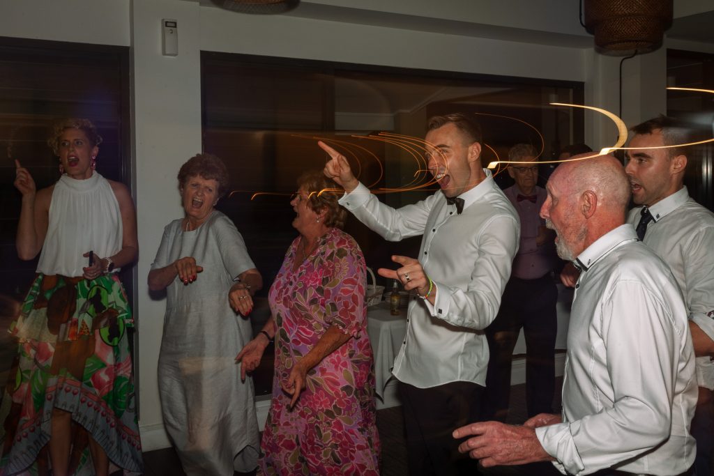 husband dancing at a wedding reception at raffertys resort