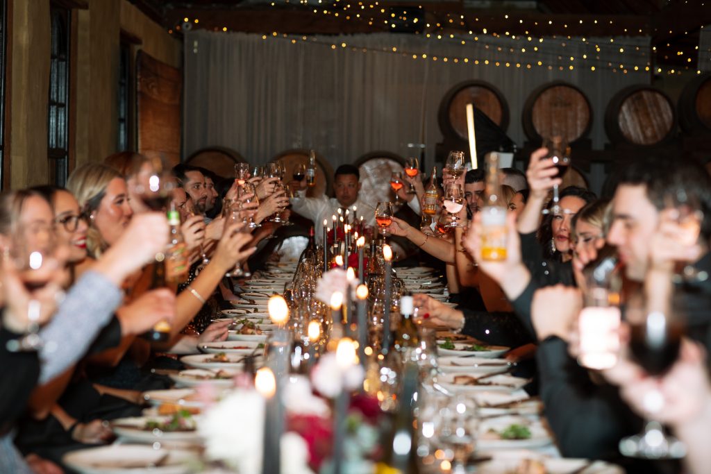 guests at the reception drinking and cheering at their wedding in the hunter valley