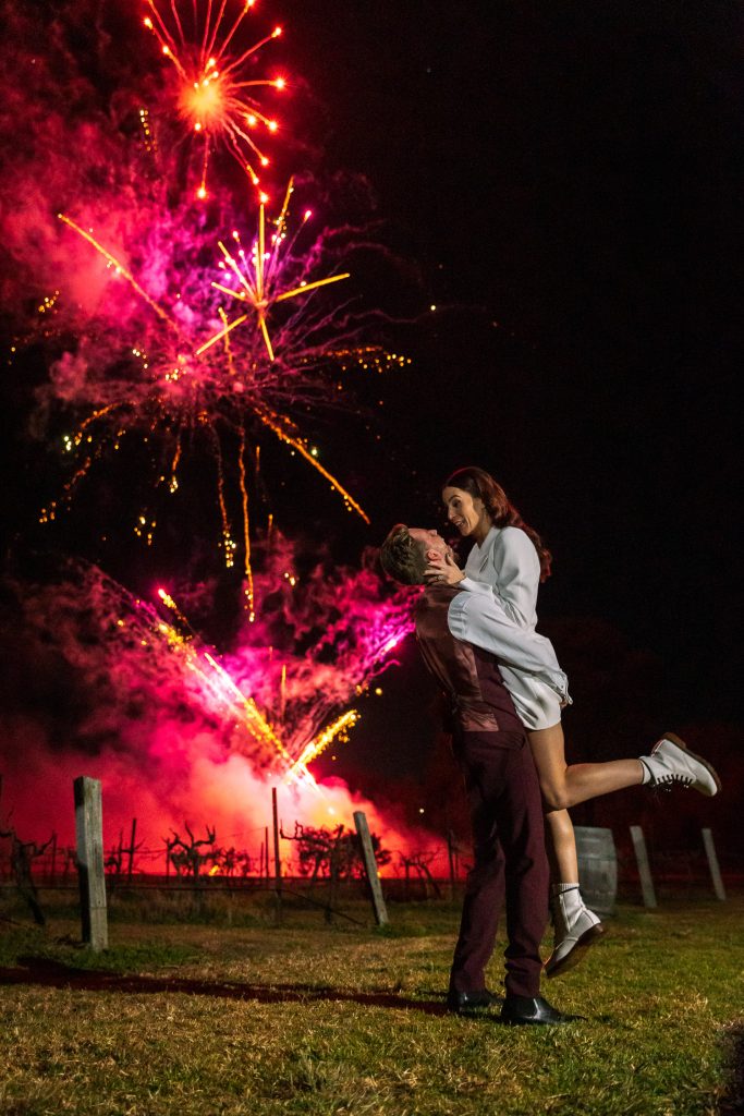 bride and grooms first dance with fireworks at the reception at their wedding in the hunter valley