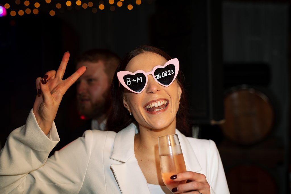 bride wearing heart sunglasses at the reception at their wedding in the hunter valley