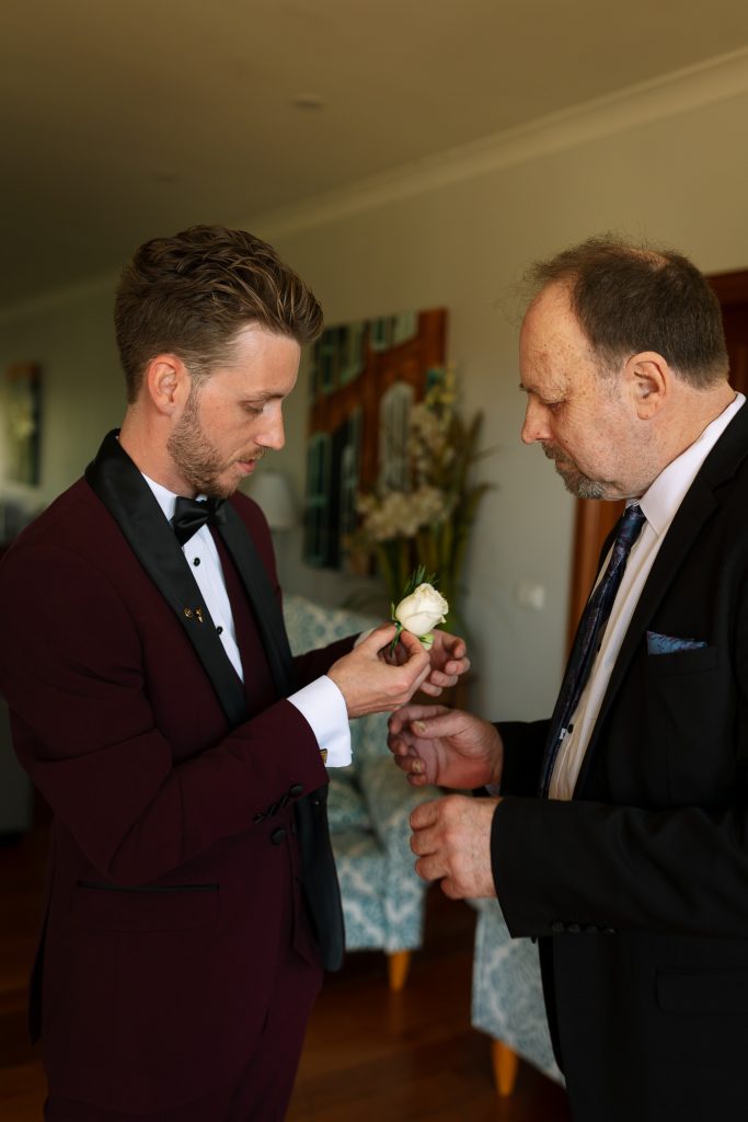 Groom with dad getting ready and accessories during prep at his wedding in the hunter valley