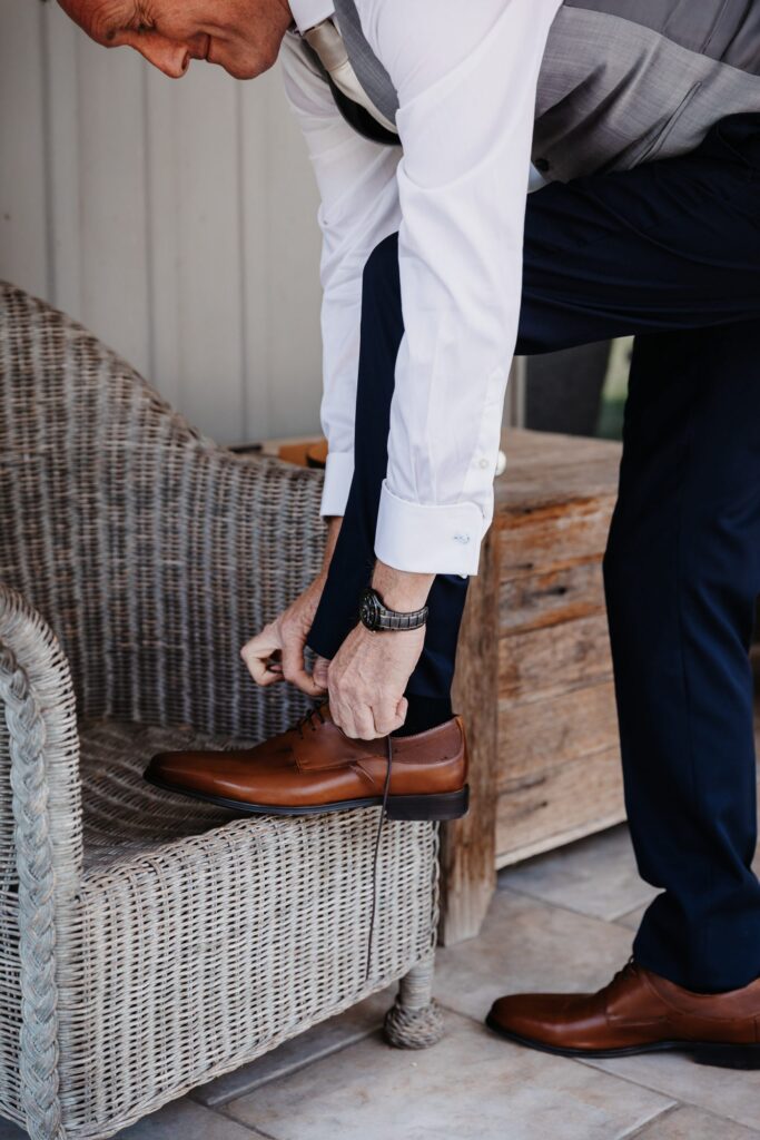 putting guys shoes on