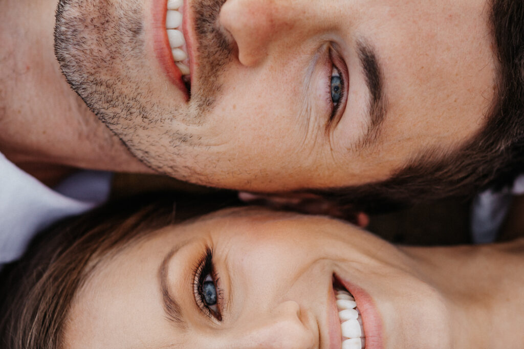 couple faces on Brighton beach