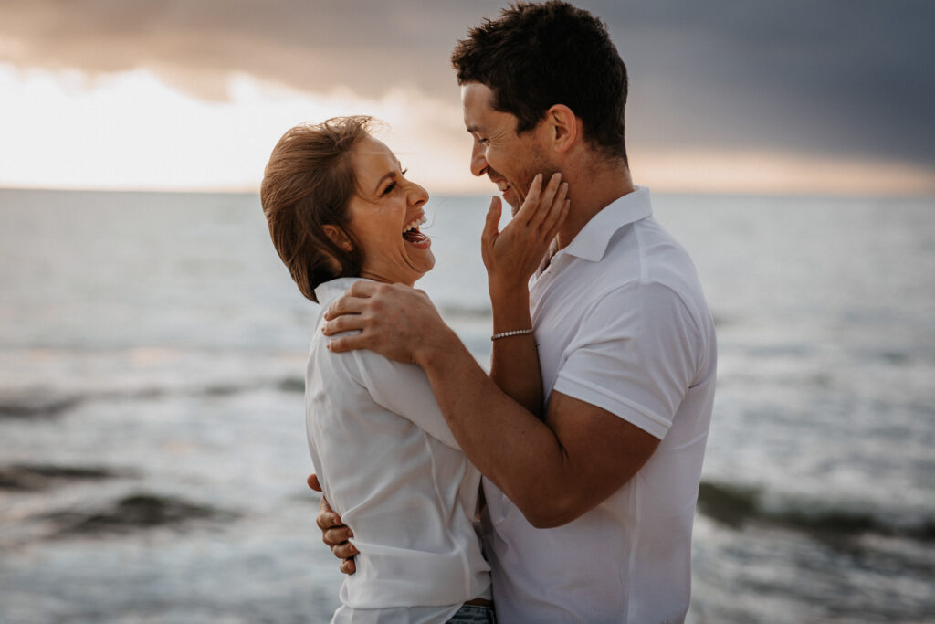 couple kiss at sunset on Brighton beach, melbourne