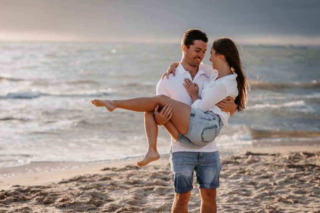 holding each other on Brighton beach