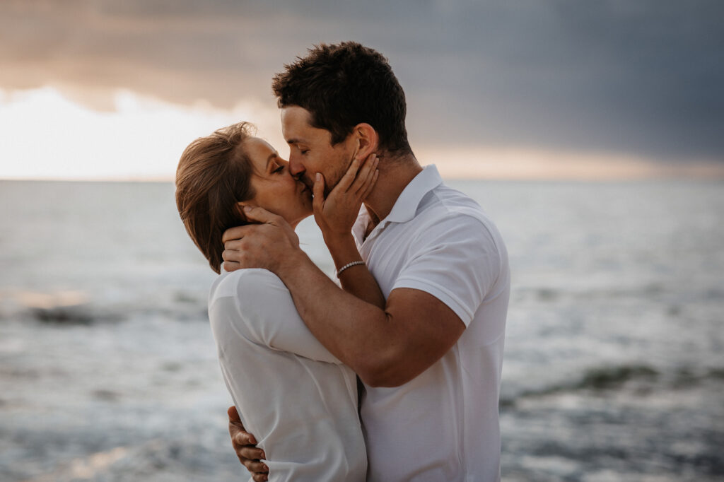 couple kiss at sunset on Brighton beach, melbourne
