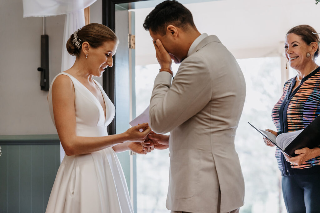 bride and groom exchanging rings at a hunter valley wedding
