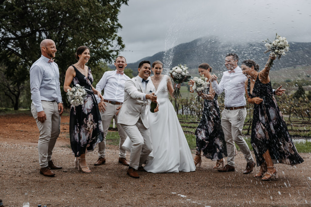popping the champagne at a wedding