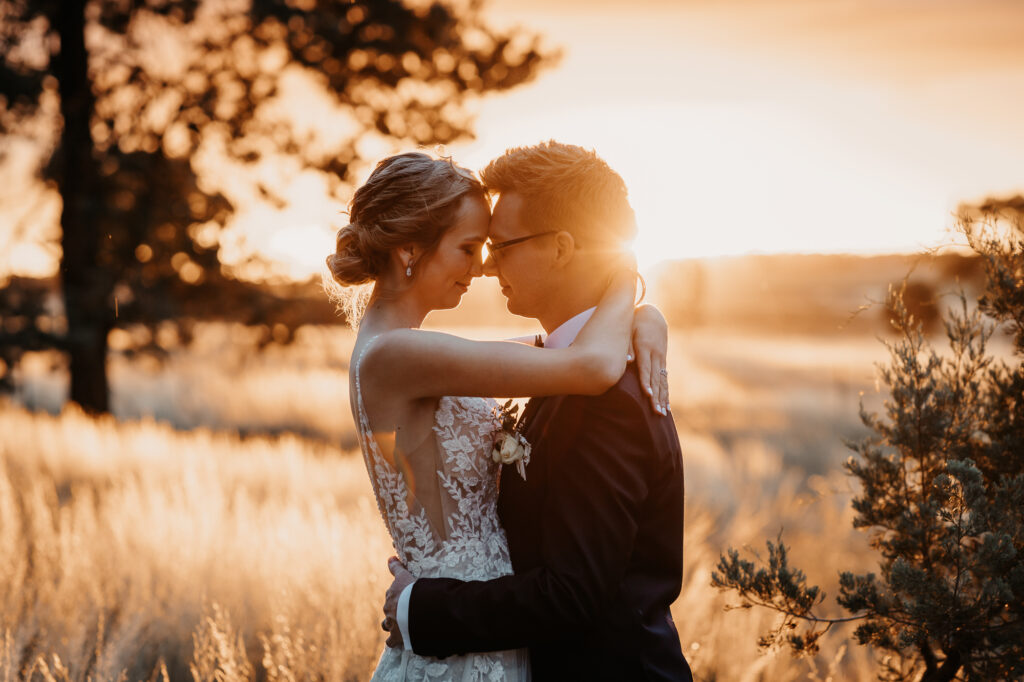 Husband and wife kissing at sunset on a location shoot Wagga Wagga