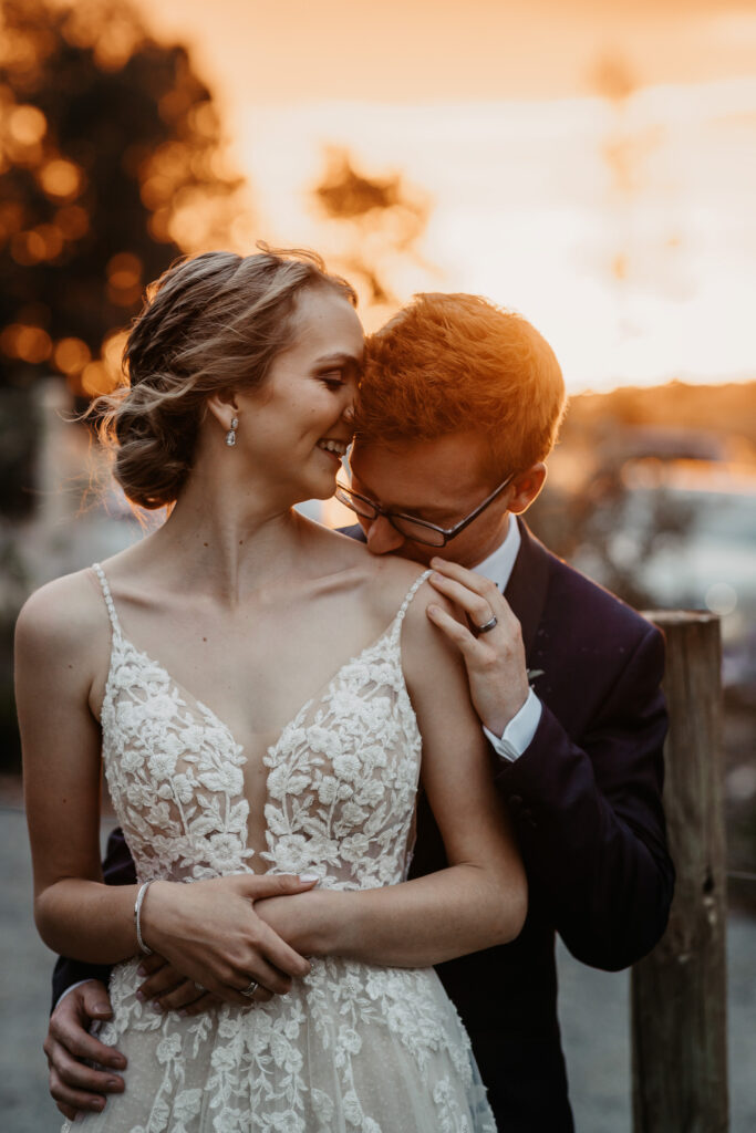 Husband and wife kissing at sunset on a location shoot Wagga Wagga