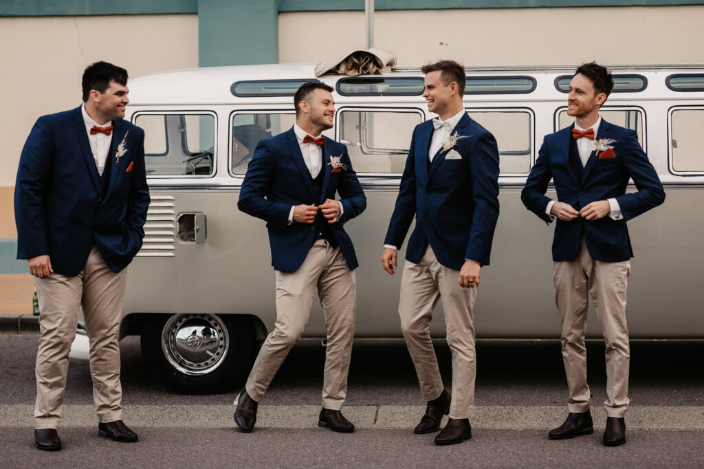 groomsmen with stretched limo