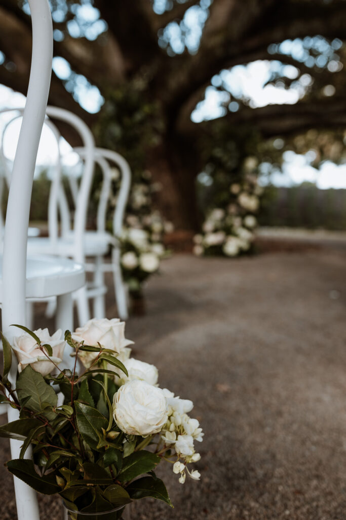 Flowers on the guests chair at a wedding