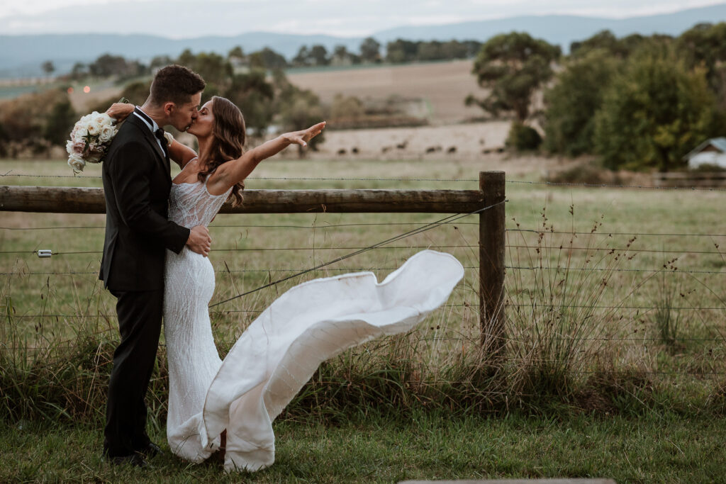 Bride throwing her dress