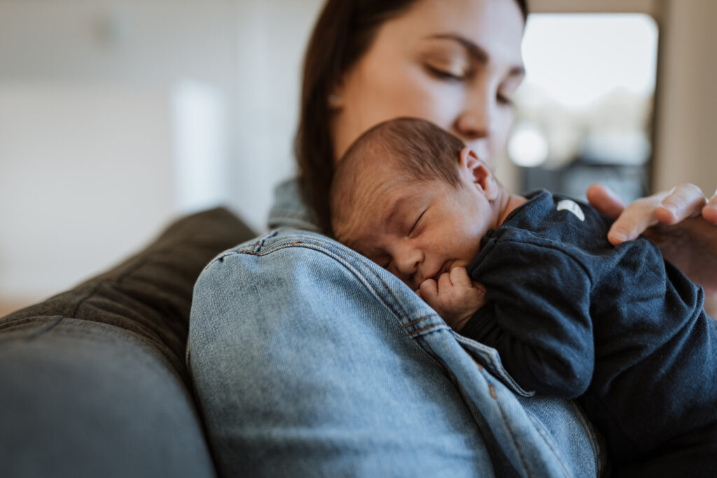 mum cuddling baby on the shoulder