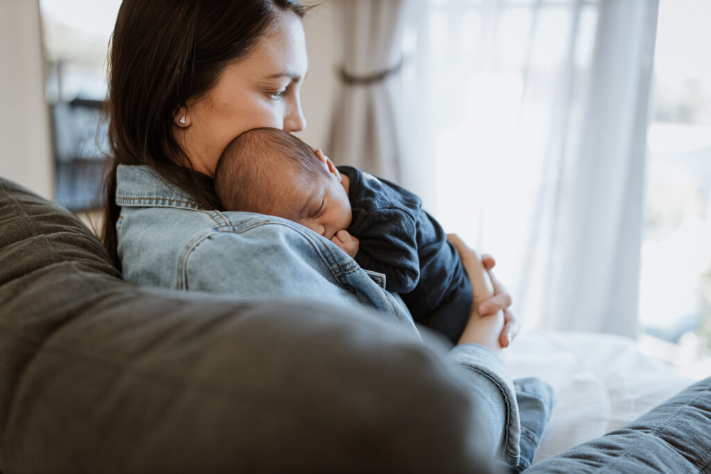mum cuddling baby on the shoulder