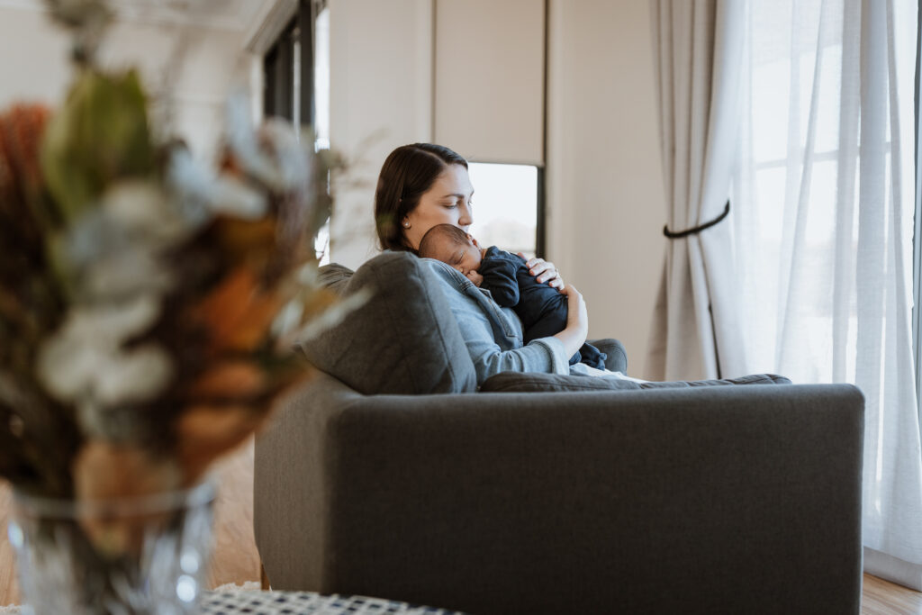 mum cuddling baby on the shoulder