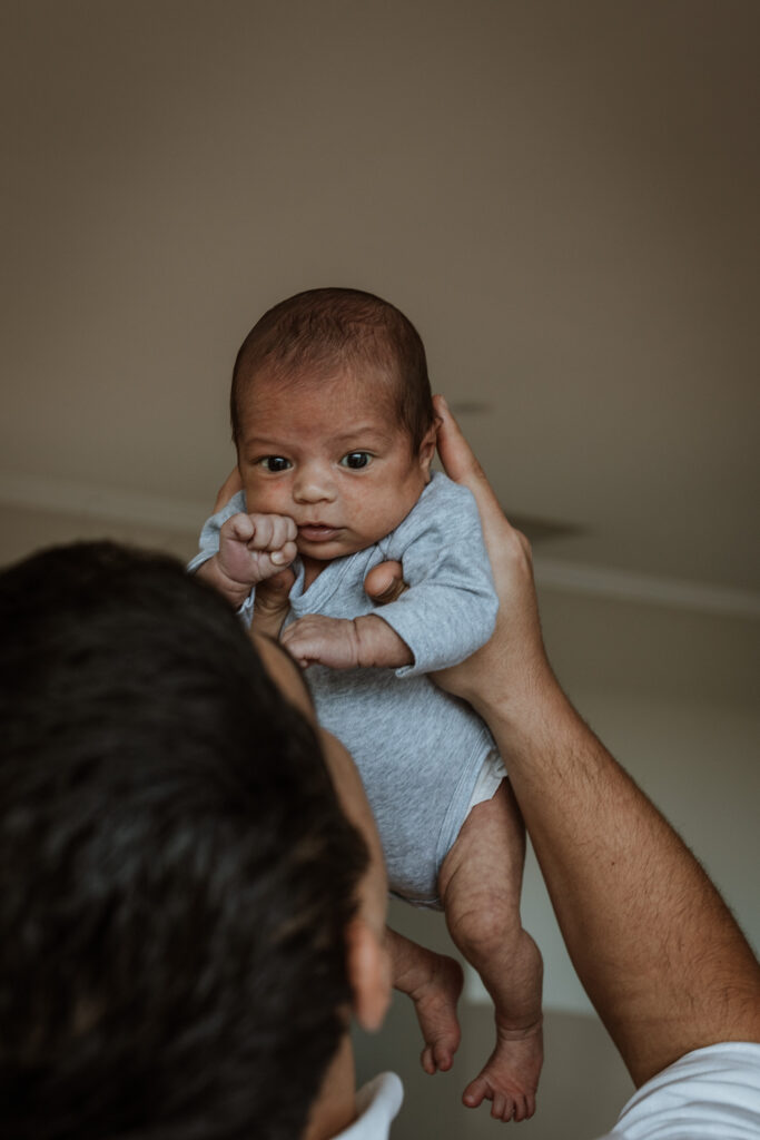 new born baby in the air