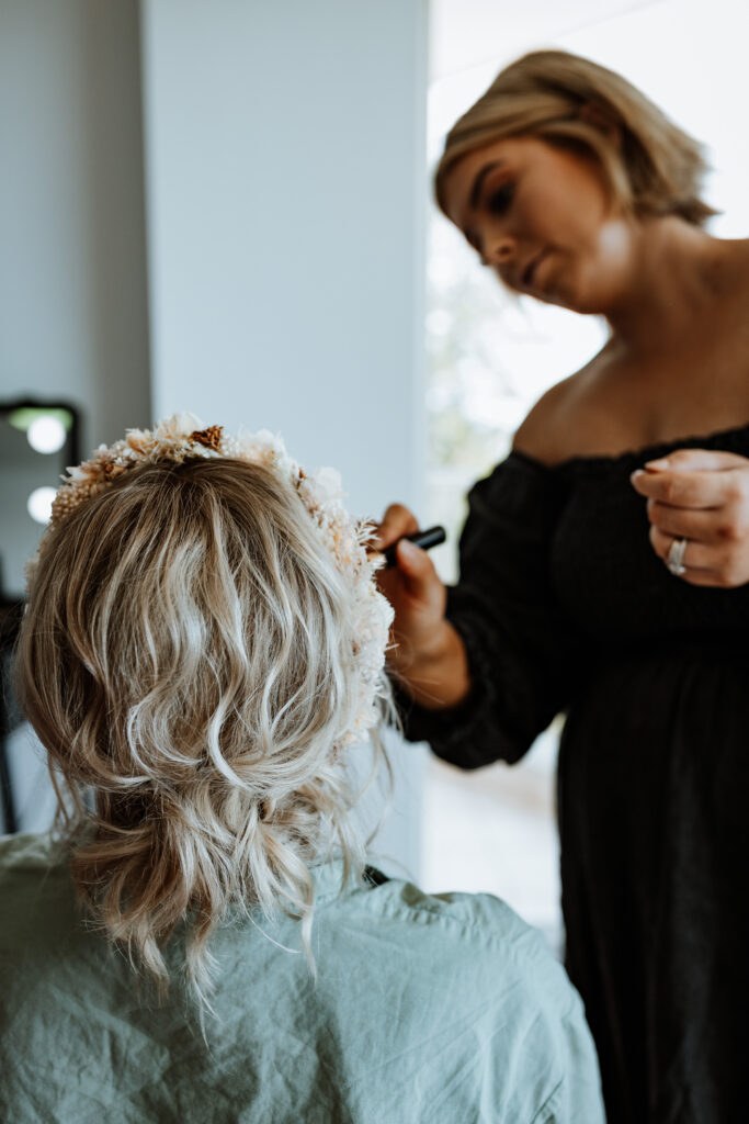 Bride getting ready and having her make up applied