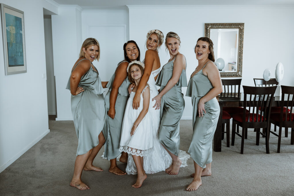 Bridesmaids all ready for the wedding wearing no shoes
