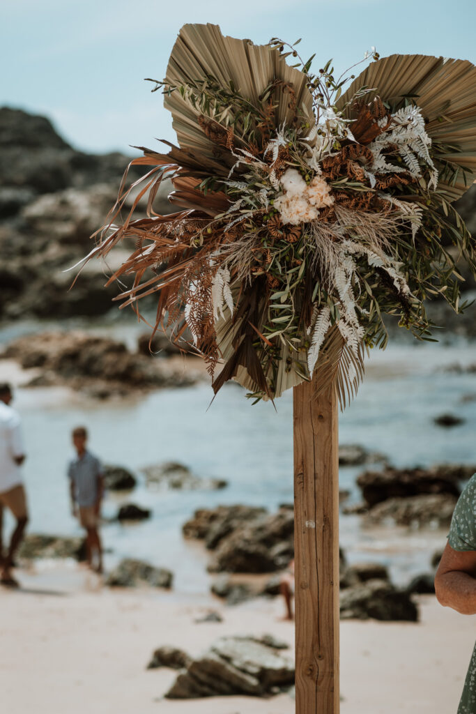 dried flowers on the arbor at the wedding in Port Macquarie down on the beach