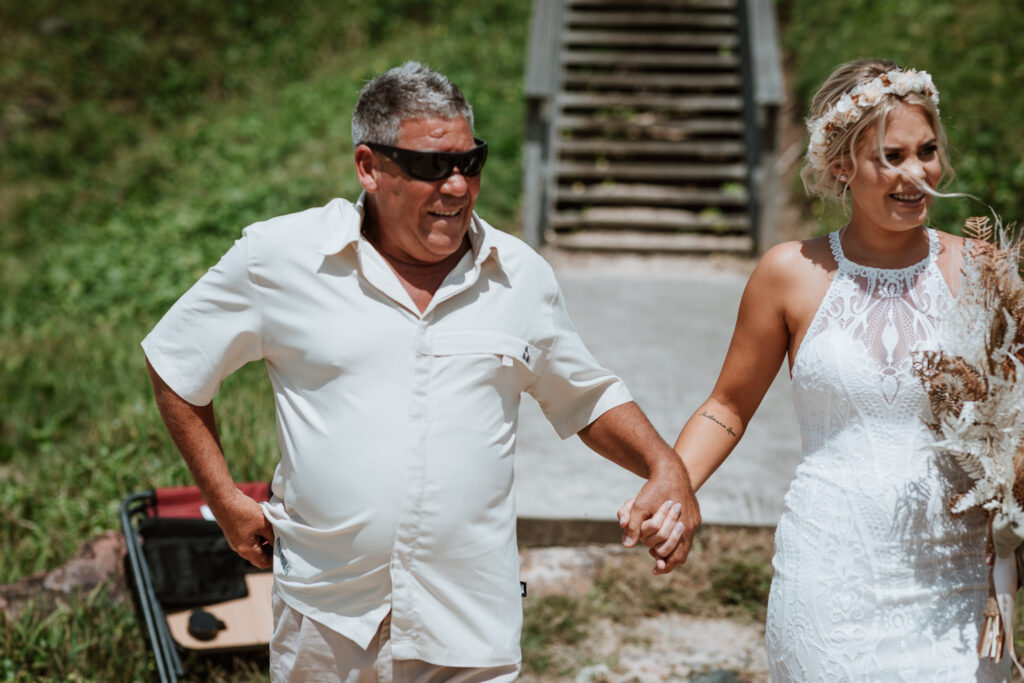 dad walking the bride down the isle on the beach in port Macquarie