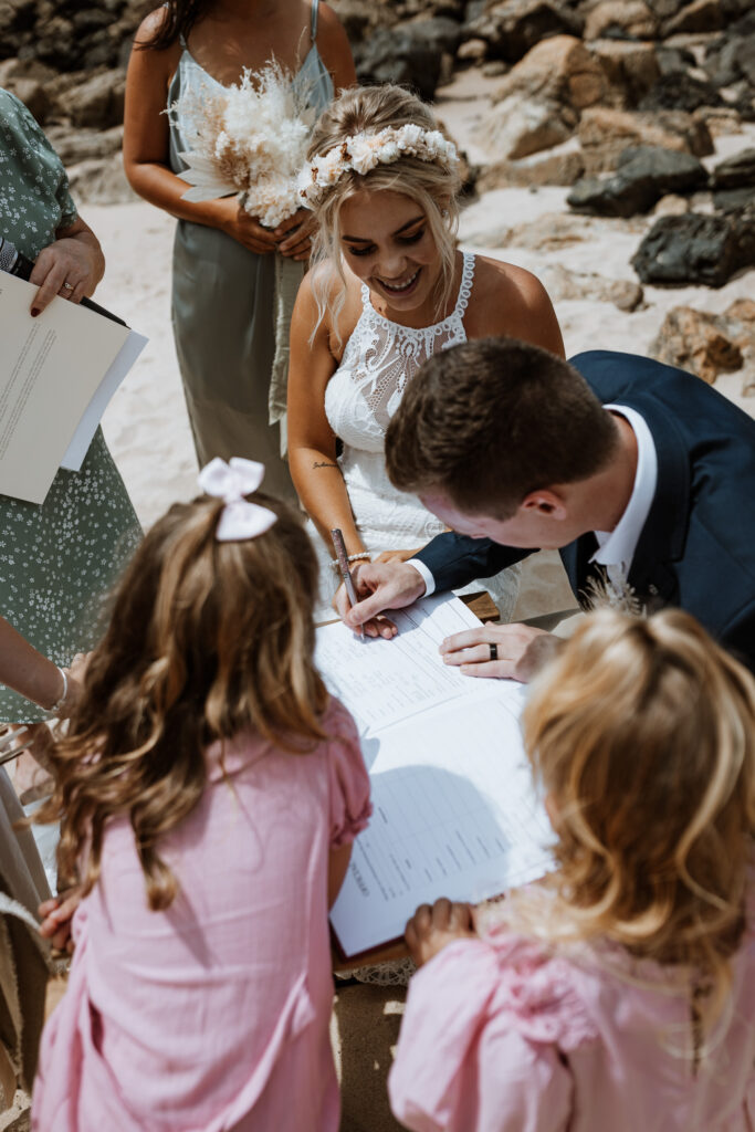 signing the papers at he beach in Port Macquarie