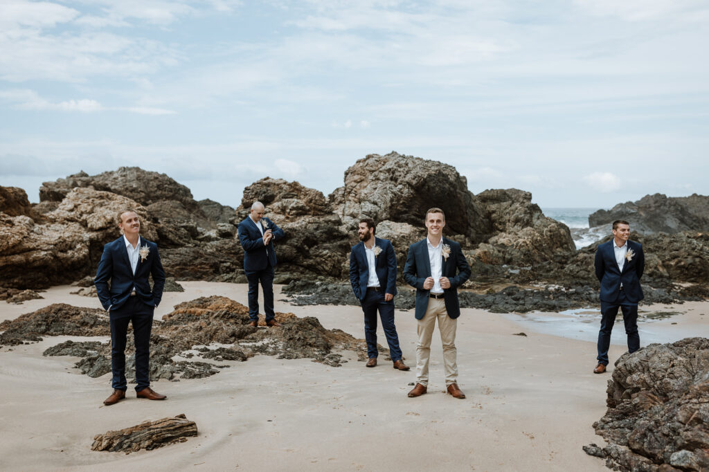 husband and wife photo shoot on the beach in Port Macquarie with the groomsmen
