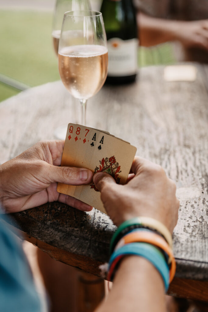 groomsmen getting ready photos hanging out playing cards