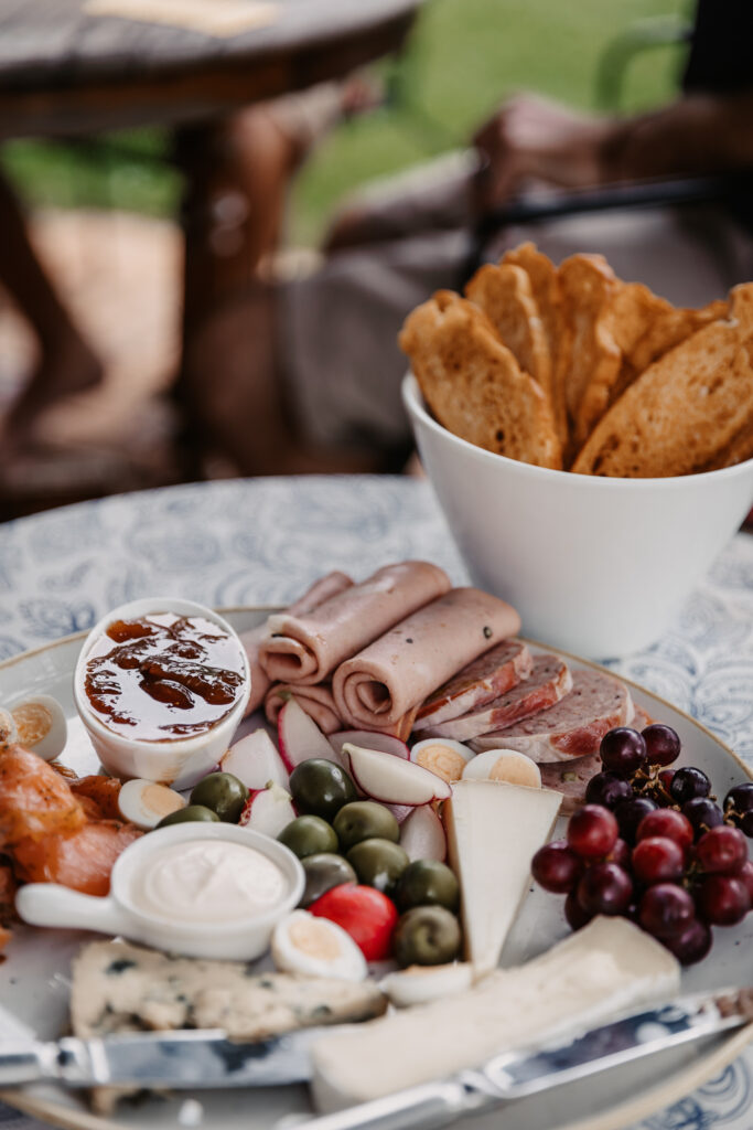 groomsmen getting ready eating a platter of food