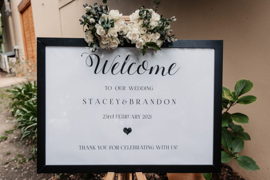 welcome sign at a garden wedding