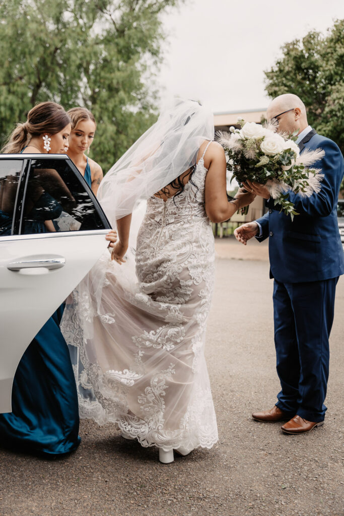 bride getting out of the car at her wedding in the hunter valley
