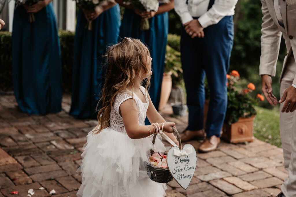 flower girl walking down the isle