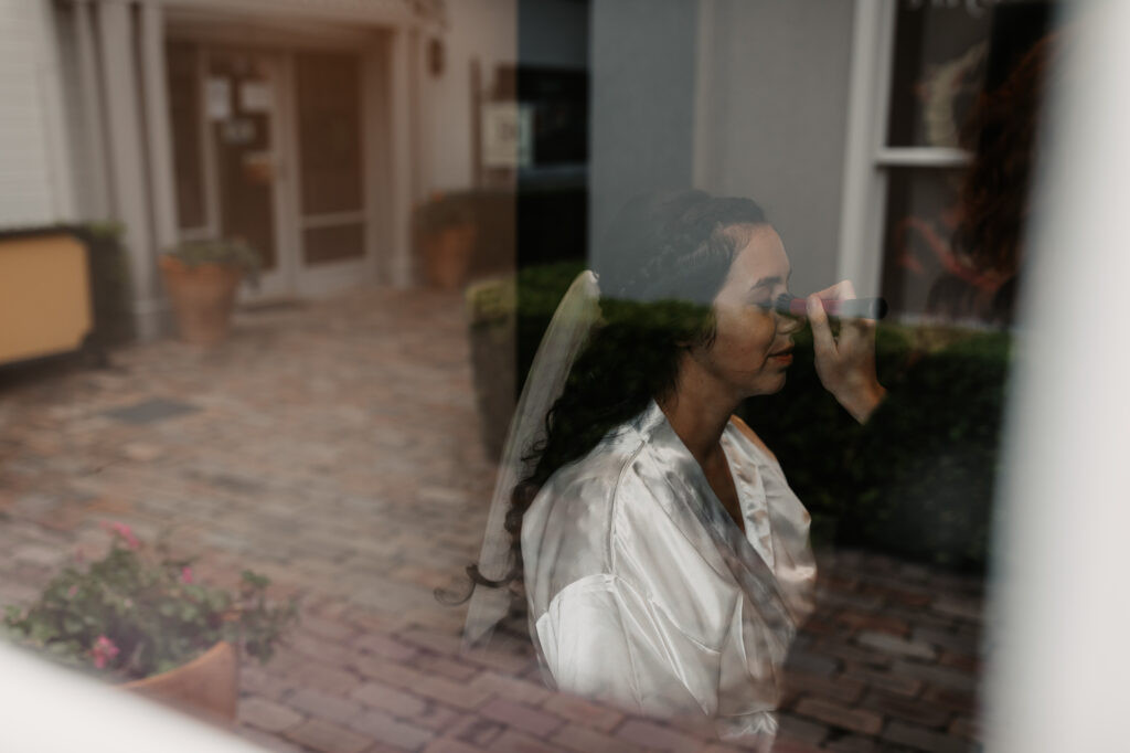 bride to be getting her make up done