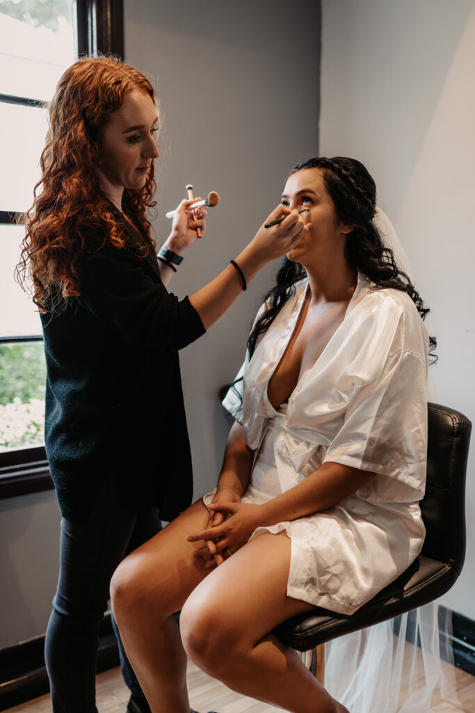bride to be getting her make up done