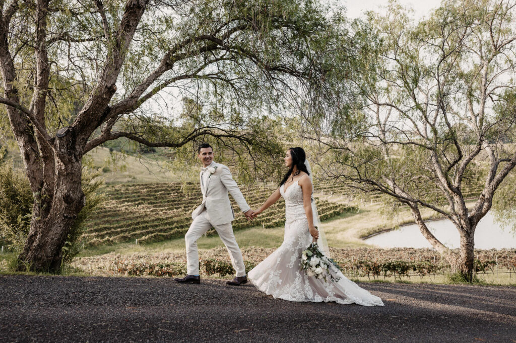 husband and wife walking up a hill