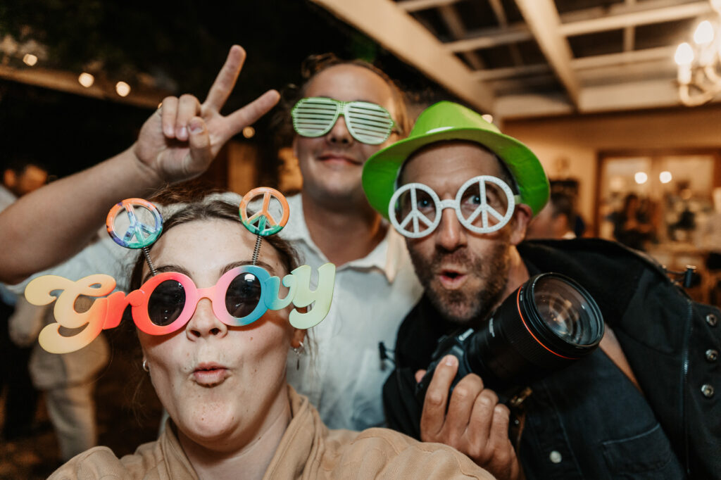 Wedding vendors playing around at the Photo Booth