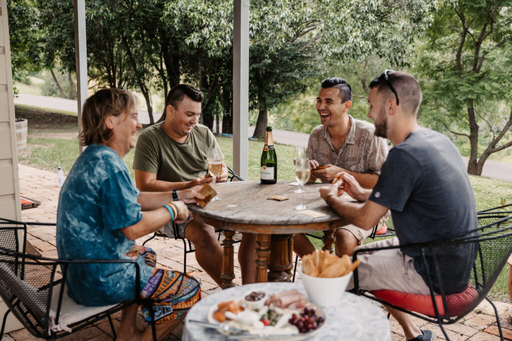groomsmen getting ready photos hanging out playing cards