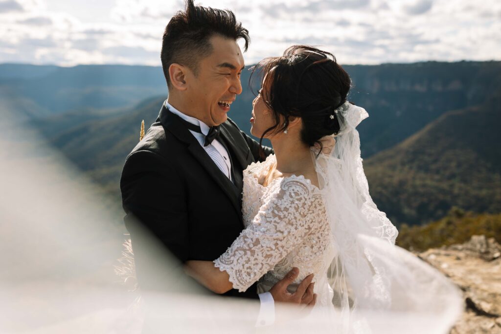 Vale in the wind. Engaged couple having an engagement session at the top of the blue mountains