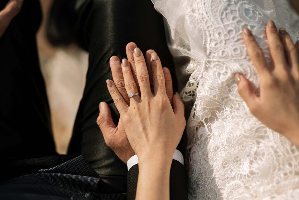 Engagement Ring on her hand on his hand. Engaged couple having an engagement session at the top of the blue mountains