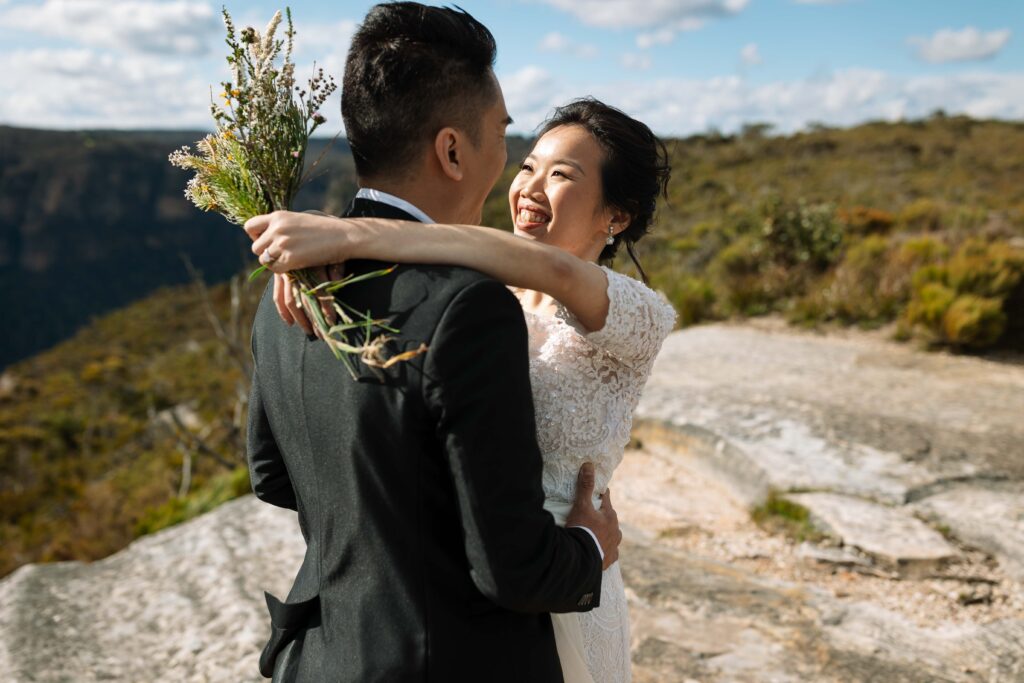 Fiancé hugging. Engaged couple having an engagement session at the top of the blue mountains