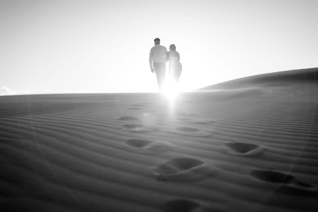 Engagement session sunset at Stockton sand dunes in black and white