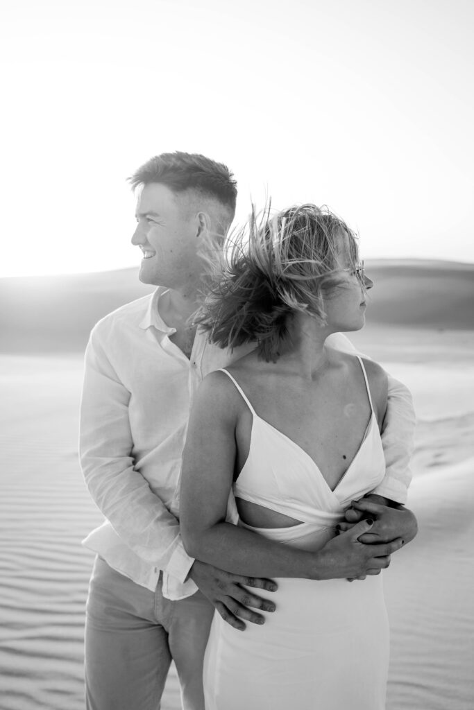 Engagement session sunset at Stockton sand dunes in black and white