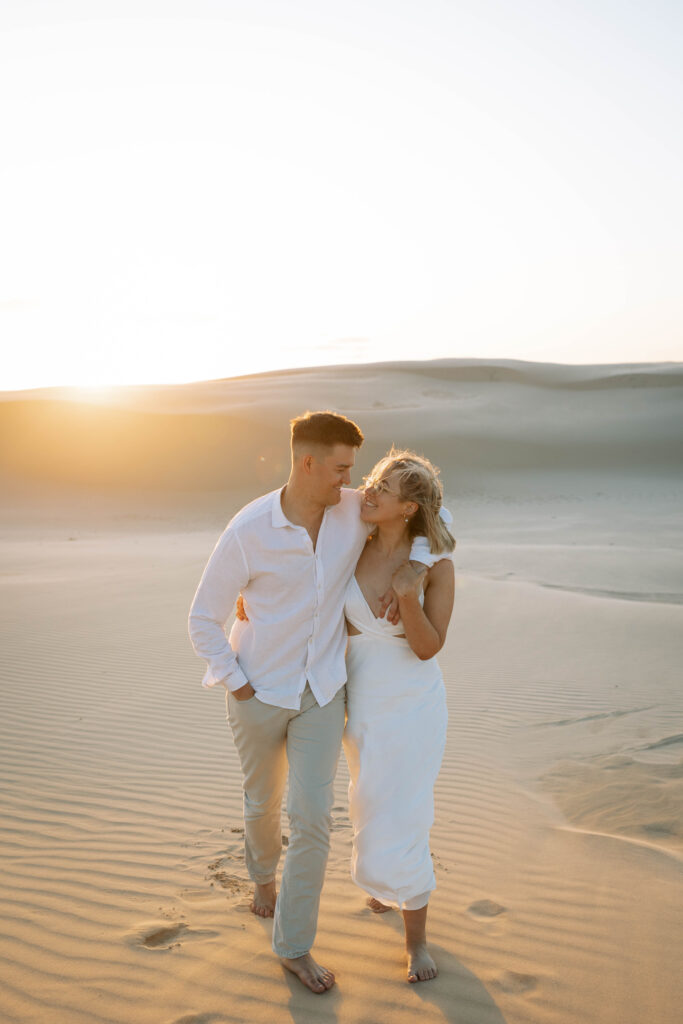Engagement session sunset at Stockton sand dunes.