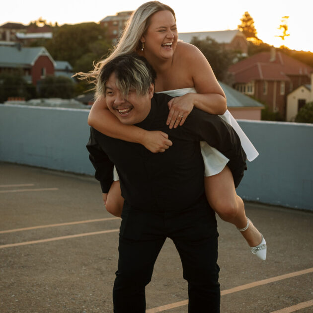 Engagement Session on a roof top car park in Newcastle, NSW. Piggy back photo