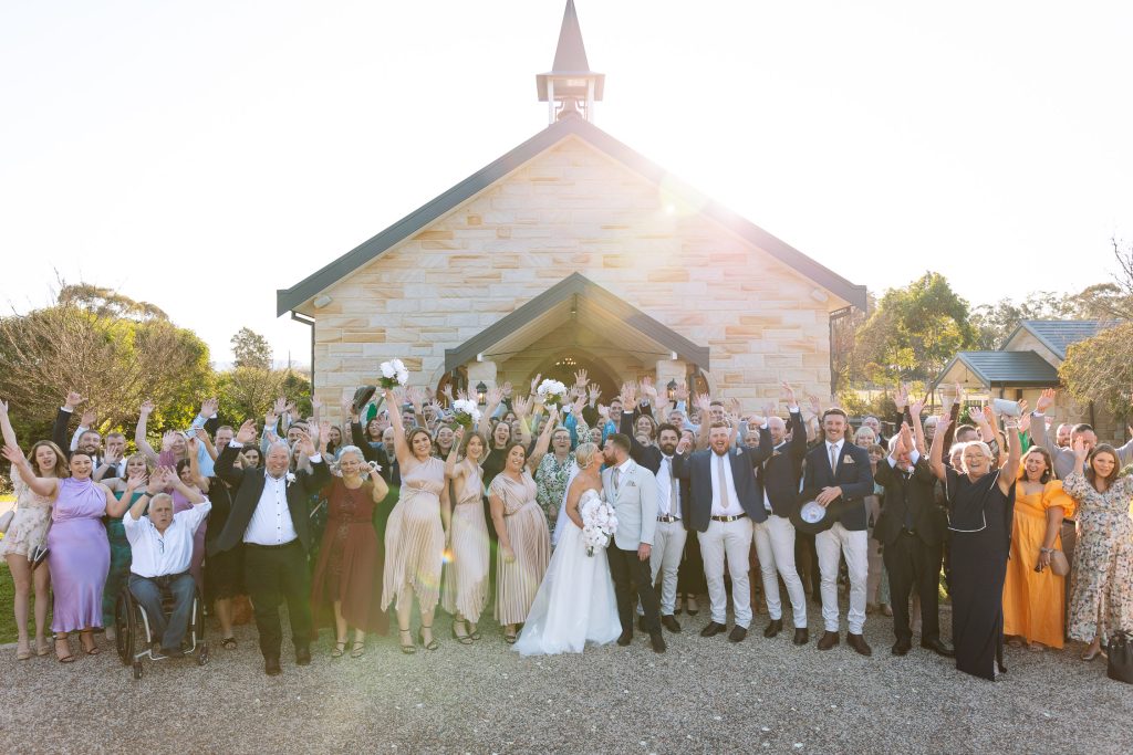 big group photo outside the chapel at a wedding in the hunter valley