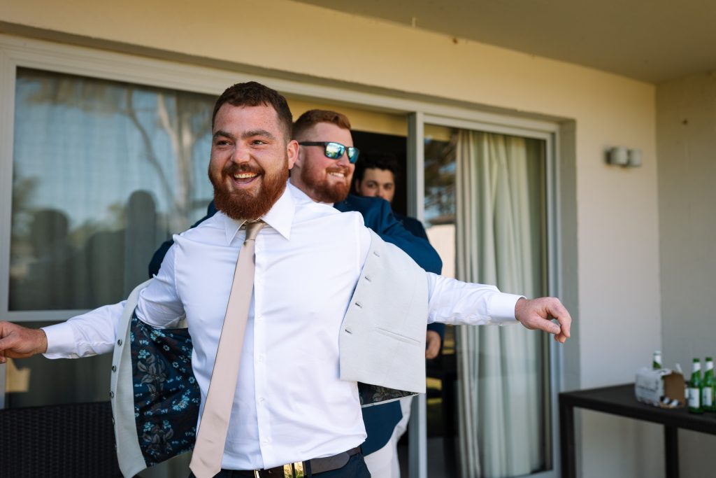 groom getting ready with groomsmen at his wedding in the hunter valley