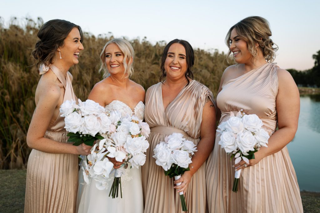 bridesmaids laughing and being candid at a wedding in the hunter valley